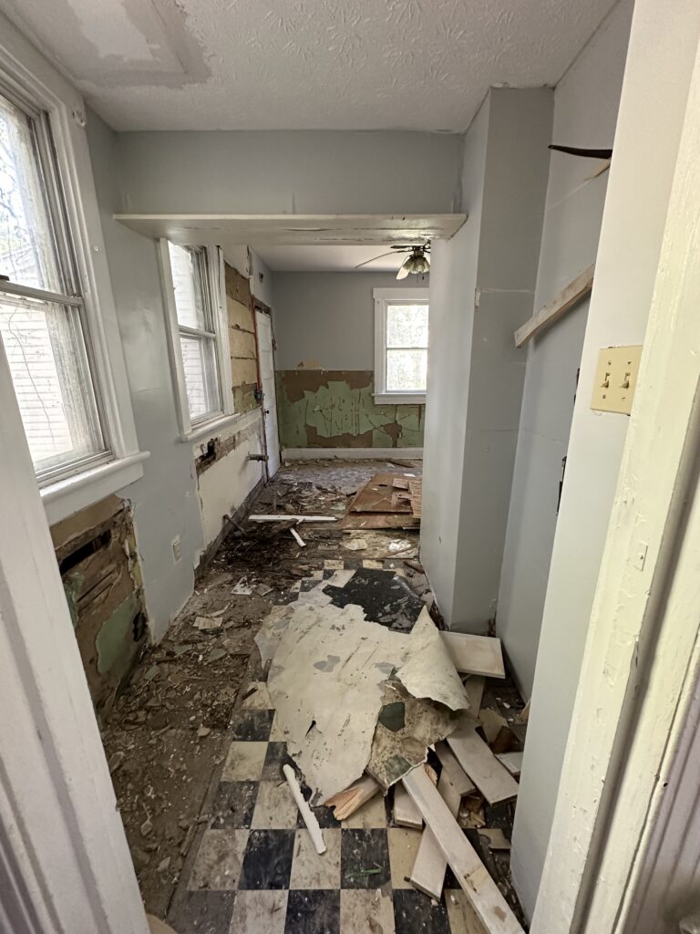 Layers of old kitchen flooring torn up