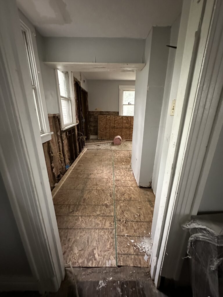 Tongue-and-groove Douglas fir subfloor installed across the kitchen