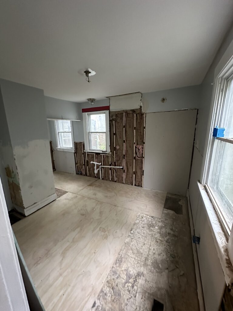 Lauan underlayment installed over the new kitchen subfloor